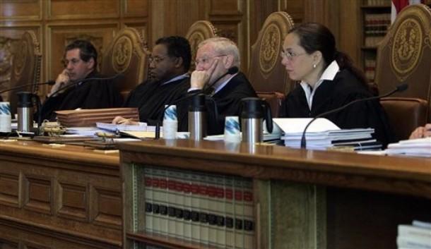 supremes4.jpg - Members of the Connecticut state Supreme Court listen to arguments on same sex marriage in Hartford, Conn., Monday, May 14, 2007. Gay and lesbian couples in Connecticut claim they are being denied their constitutional rights. From left are, Justice Richard Palmer;  Justice Flemming Norcott, Jr.; Justice David Borden; Justice Joette Katz.  (AP Photo/Bob  Child)